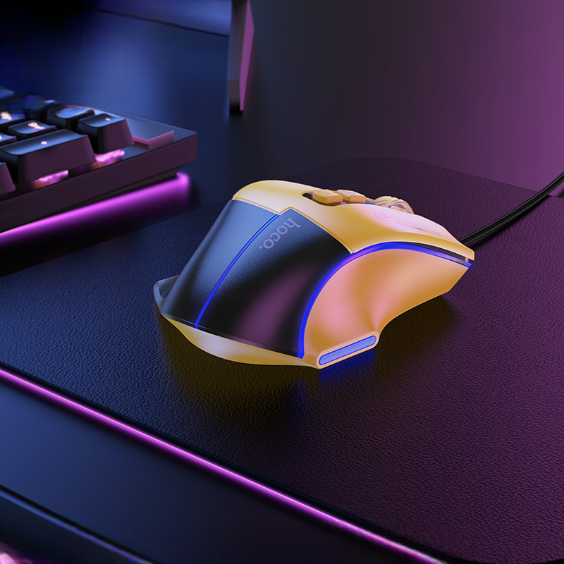 Gaming mouse with RGB lighting on a desk