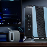 Modern computer setup with a monitor, router, and speaker on a desk.