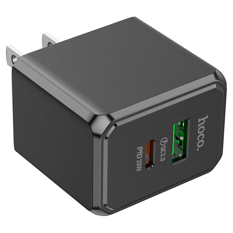 Black power adapter with dual USB ports on a white background