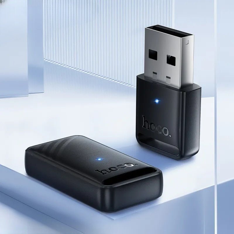 Two black USB devices with 'hoco.' branding on a light blue background