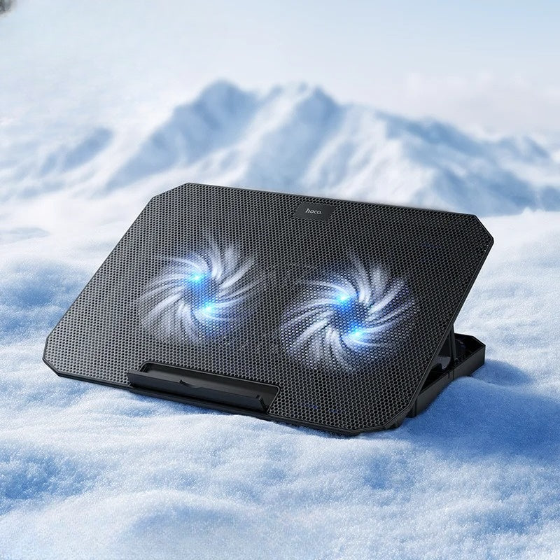 Laptop cooling pad with fans on a snowy background